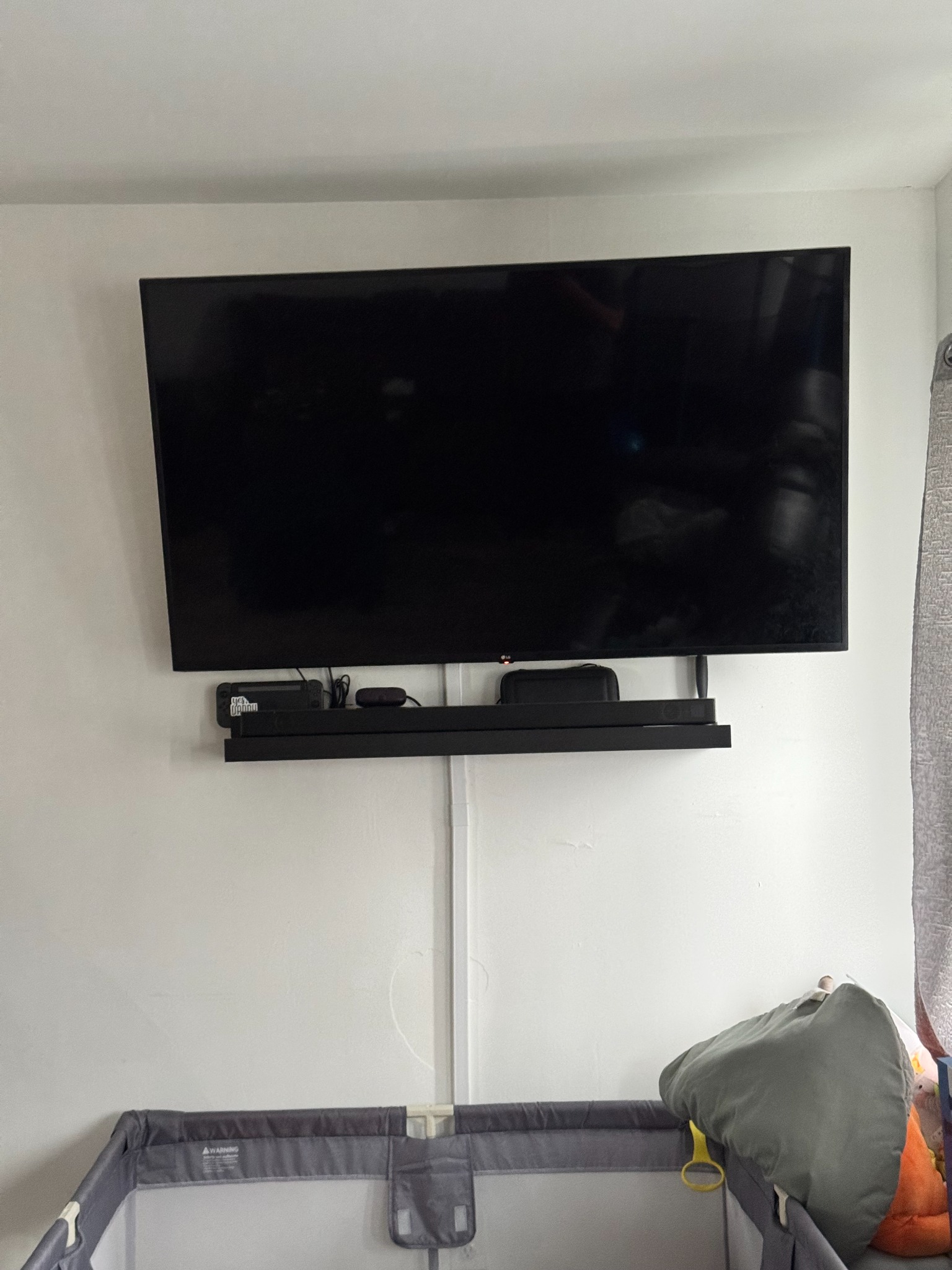 Mounted TV with shelf and cable cover by Assemble Pro NJ